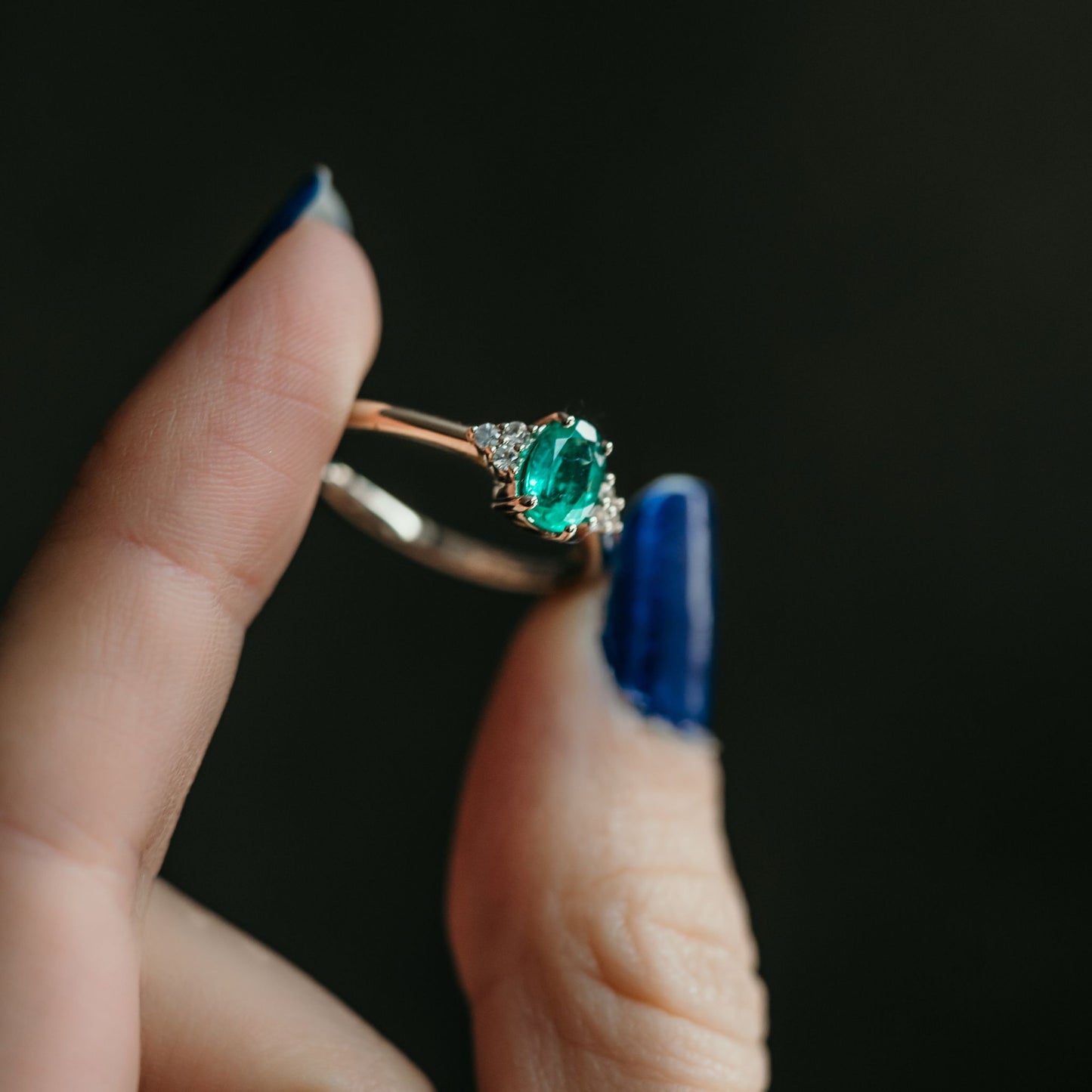 emerald ring with side stones