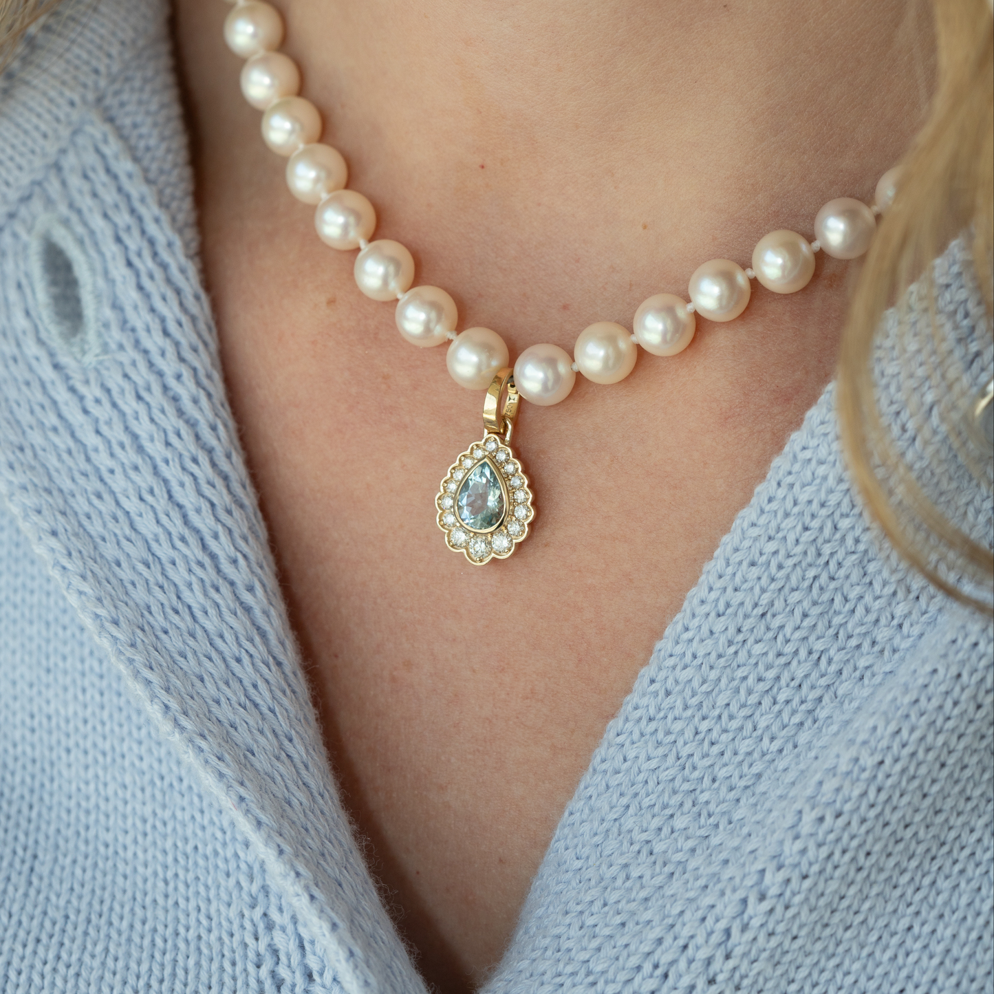 diamond and aquamarine charm on pearl necklace