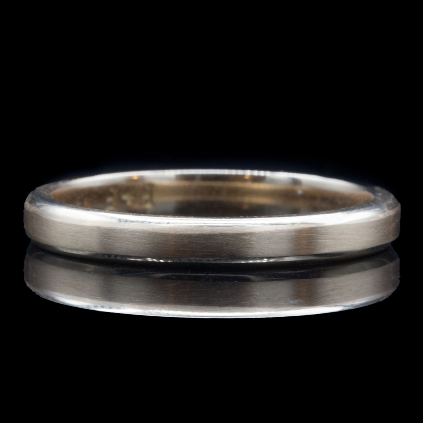 thin wedding band in gold for men beveled