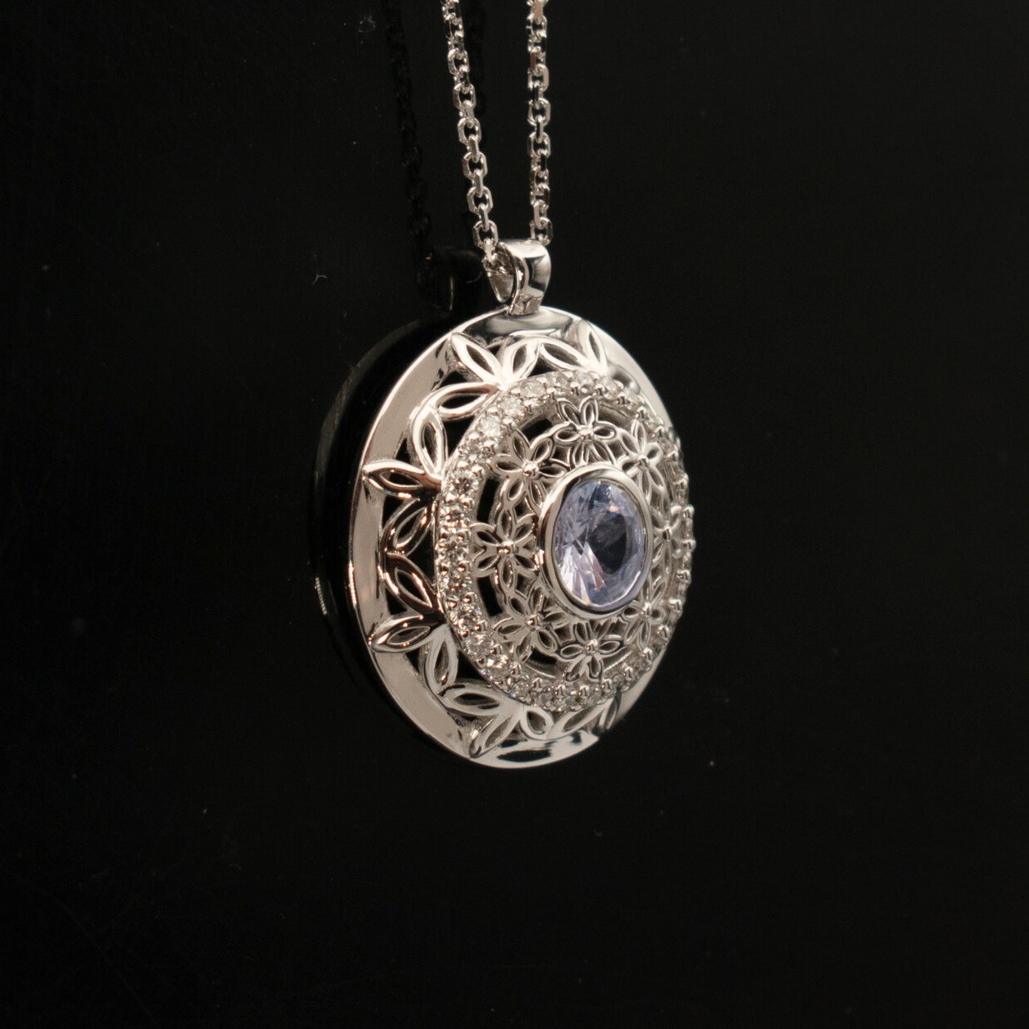 pendant with diamonds and white sapphire medallion with floral design and adjustable chain