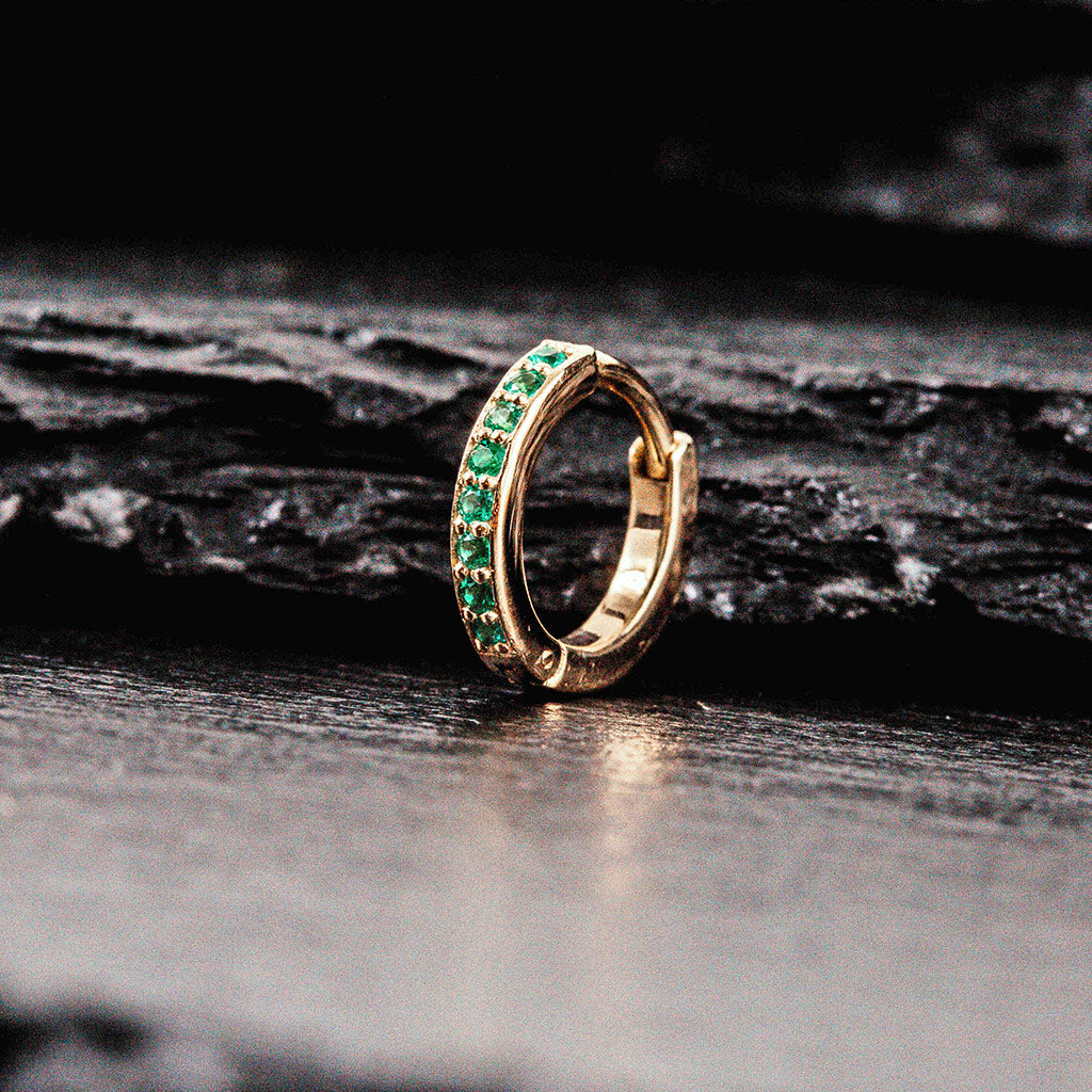 yellow gold ear cuff with emeralds