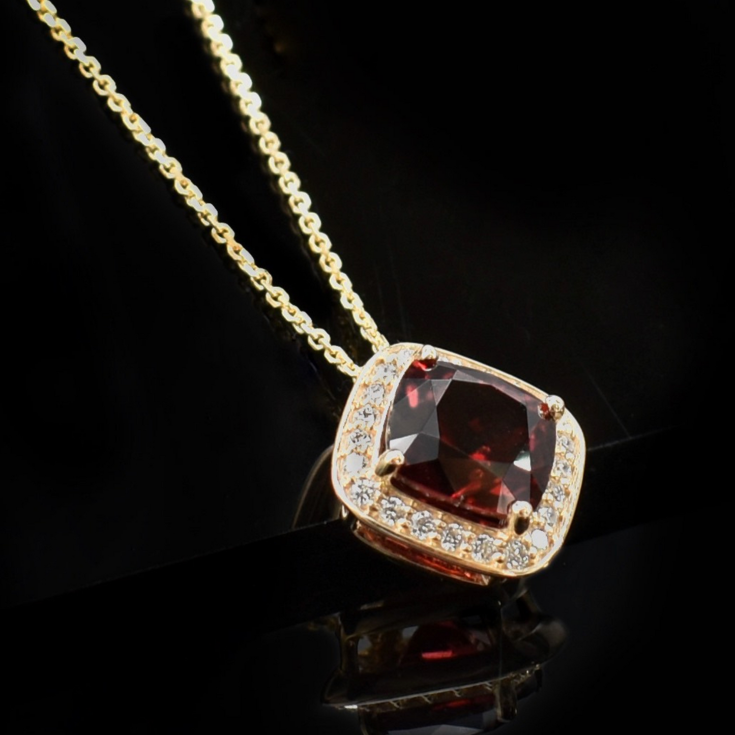 yellow gold and cushion cut garnet necklace