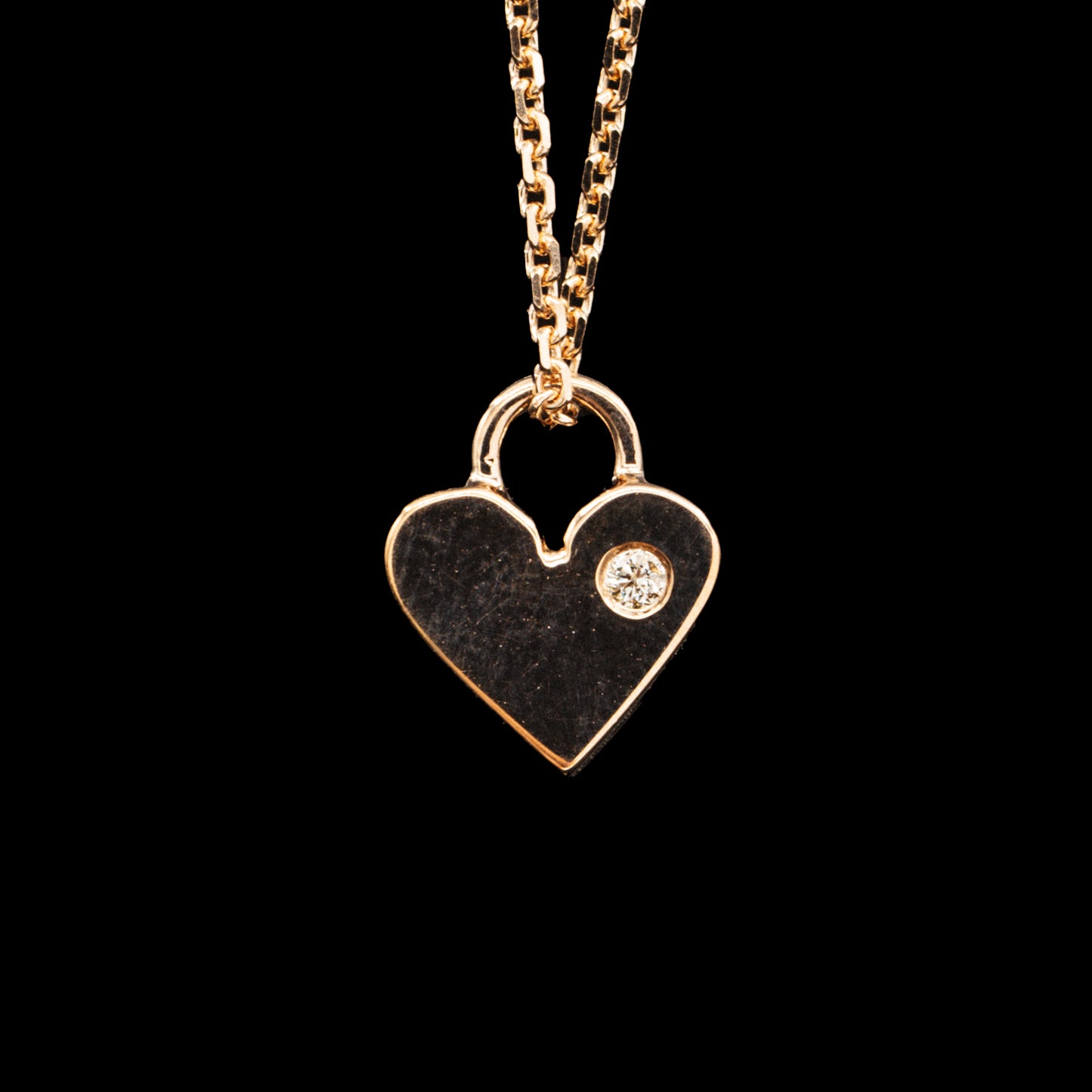 Heart shaped charm necklace with engravings
