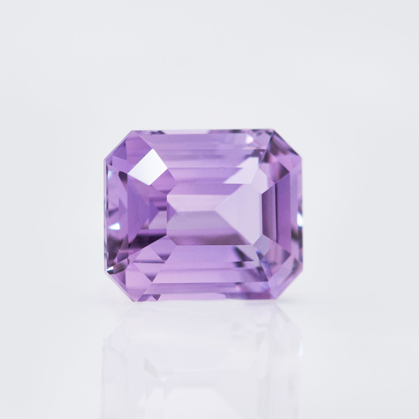 Emerald cut purply-pink sapphire 1.5cts for engagement ring