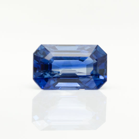 natural gemstone 3 carat emerald cut blue sapphire with color zoning 