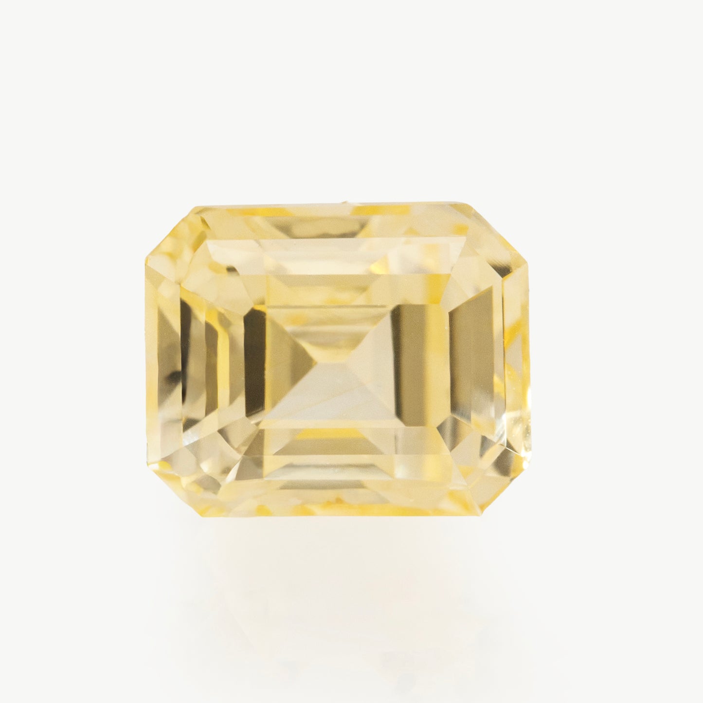 bright yellow emerald cut sapphire, no heat.