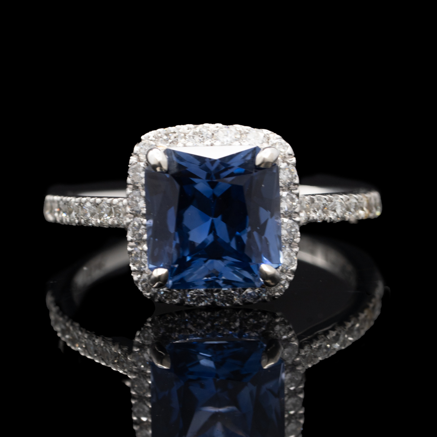 radiant cut sapphire ring with diamond halo