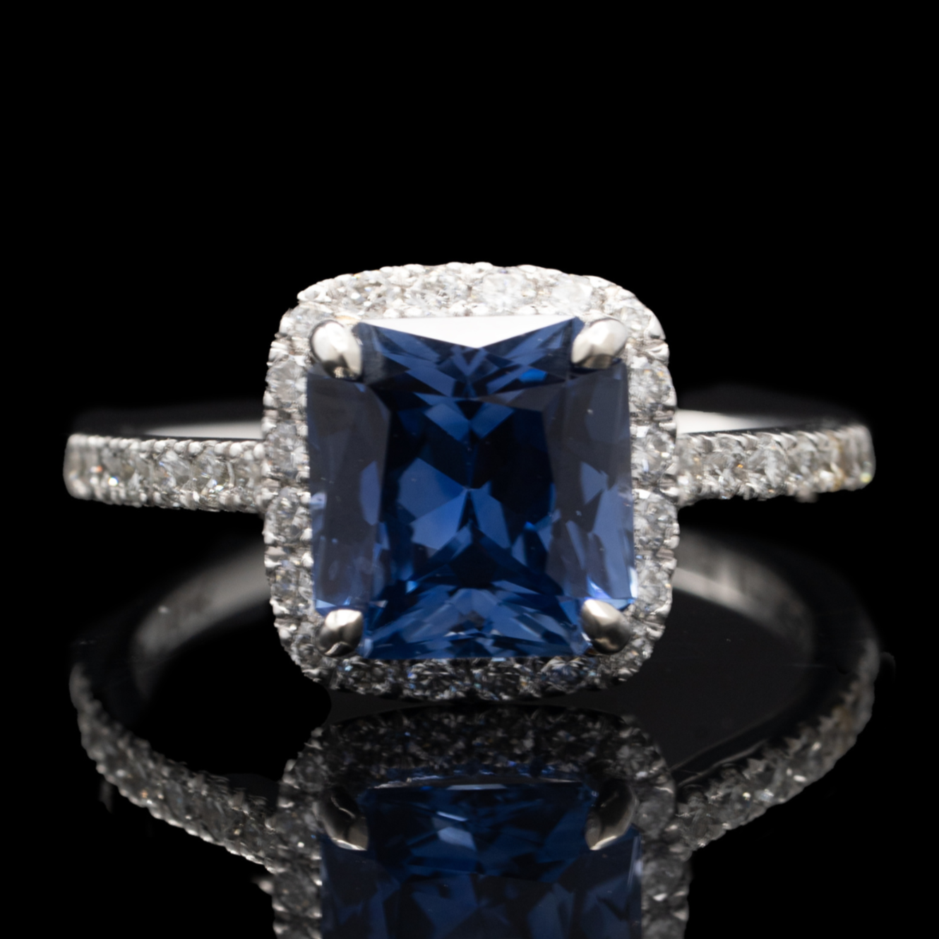 radiant cut sapphire ring with diamond halo