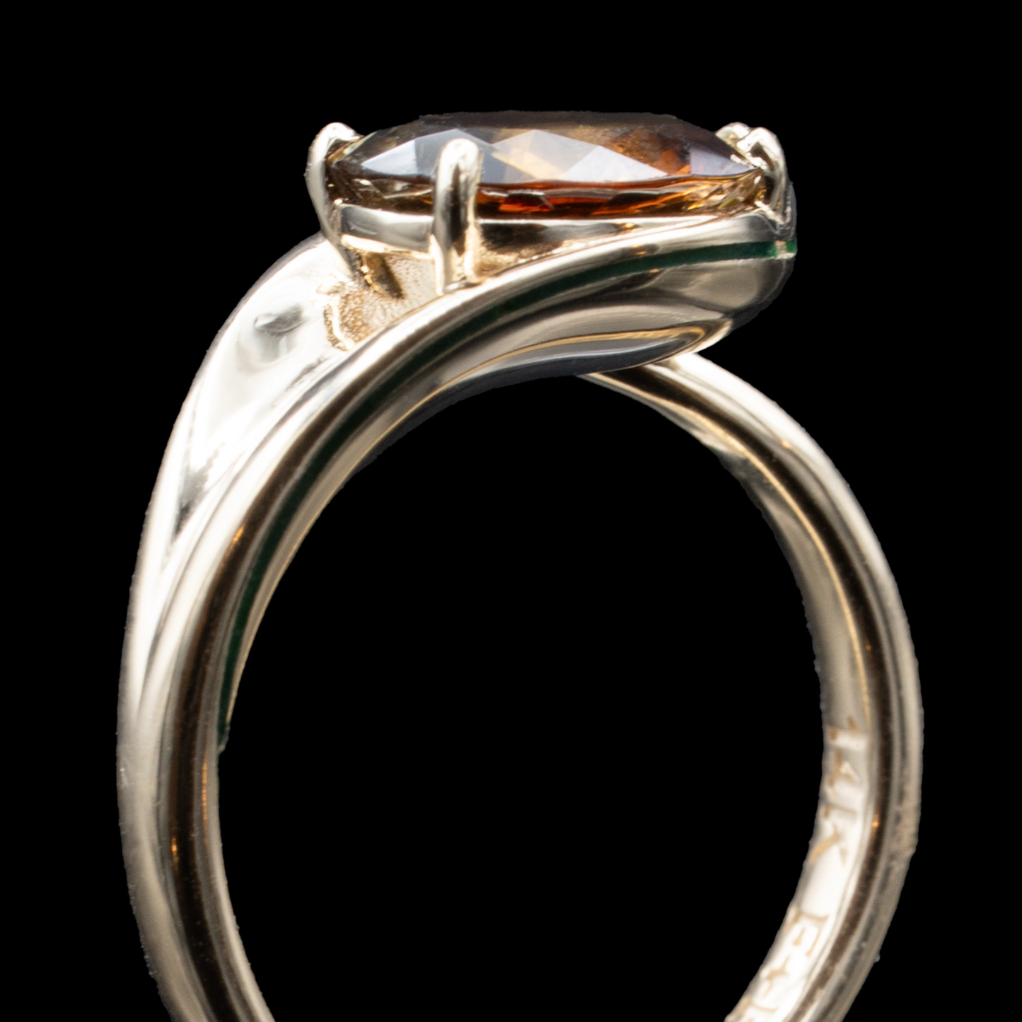 Up view of oval cut andalusite ring in gold