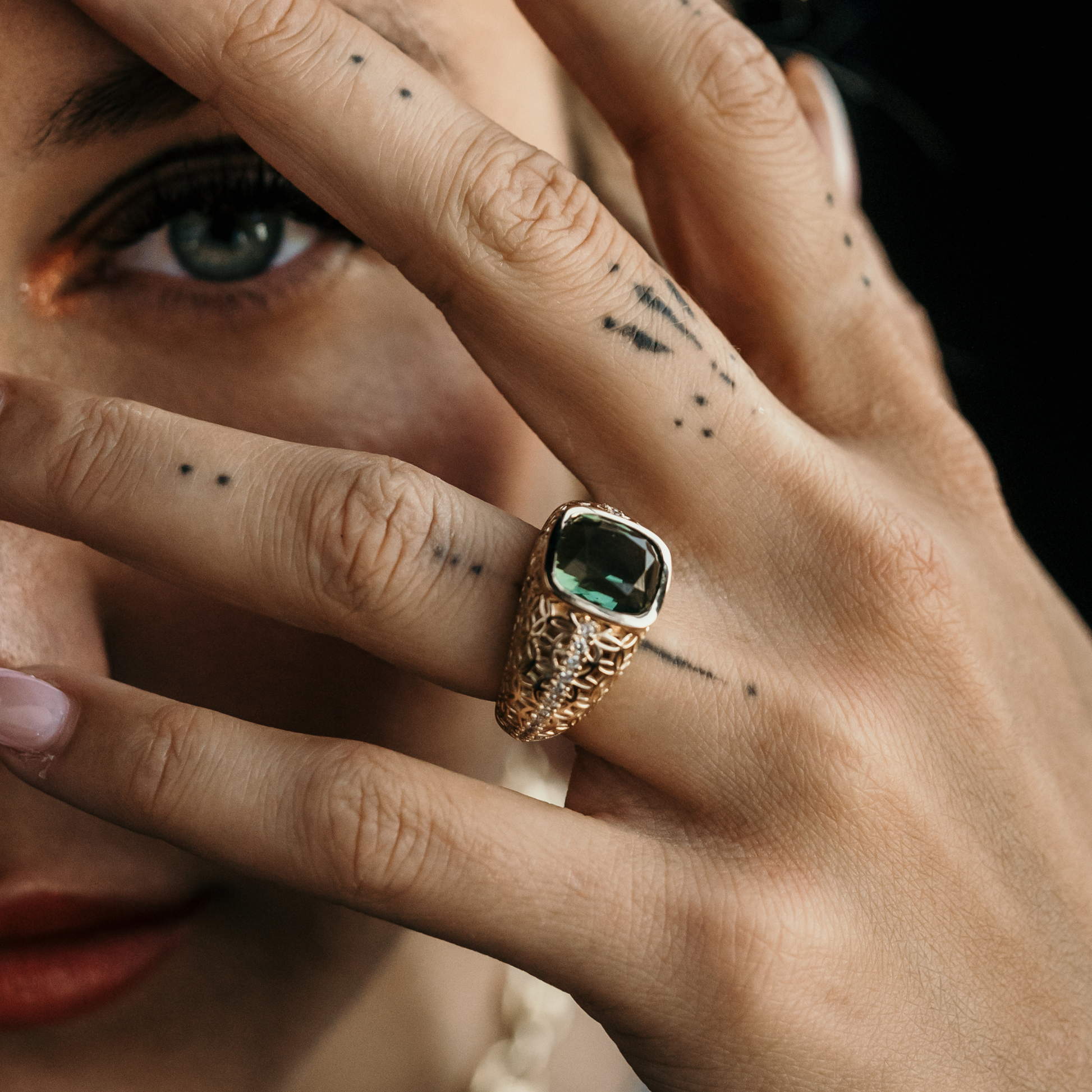 Diamond art deco ring with floral patterns and tourmaline cushion cut center stone