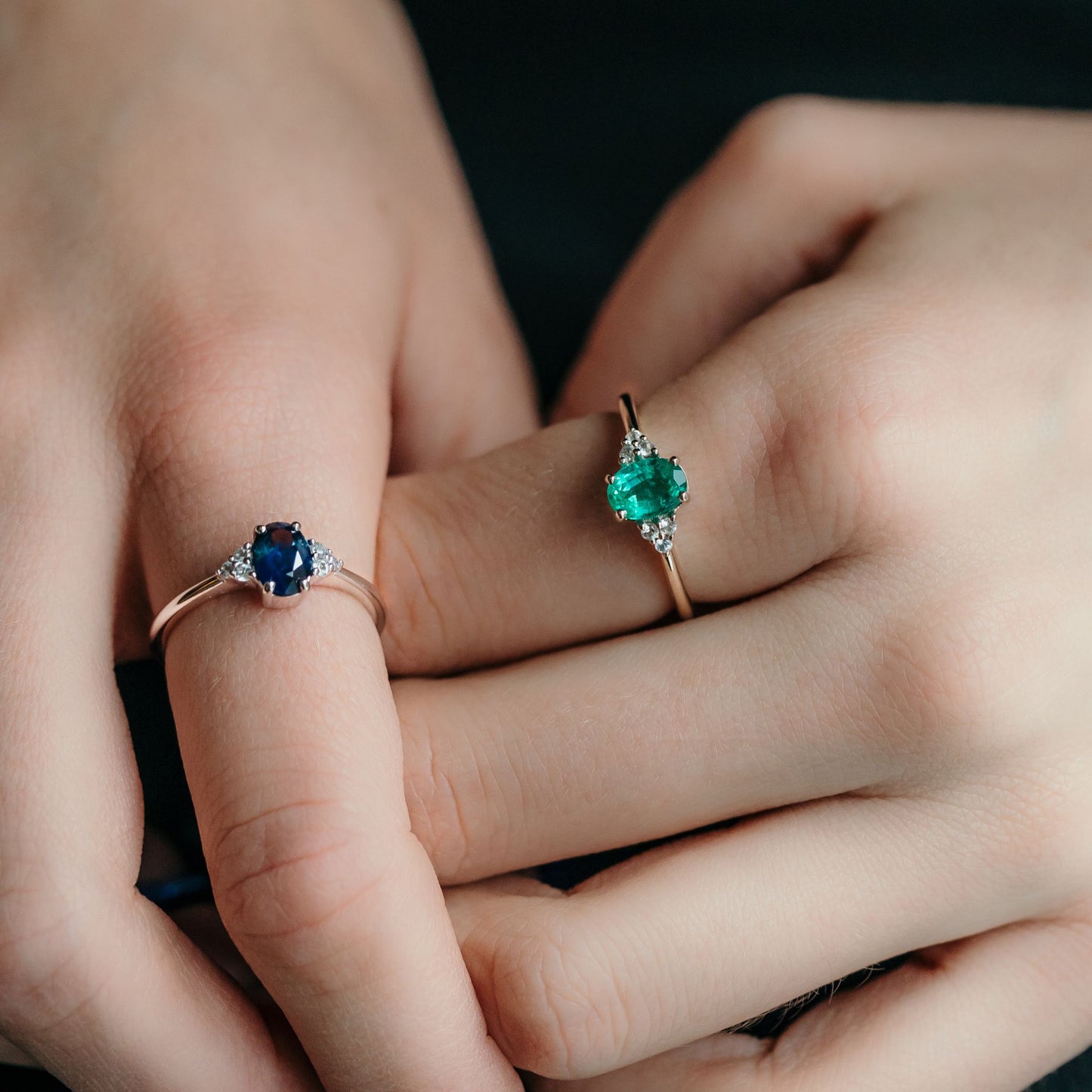 Blue sapphire and Emerald ashes rings