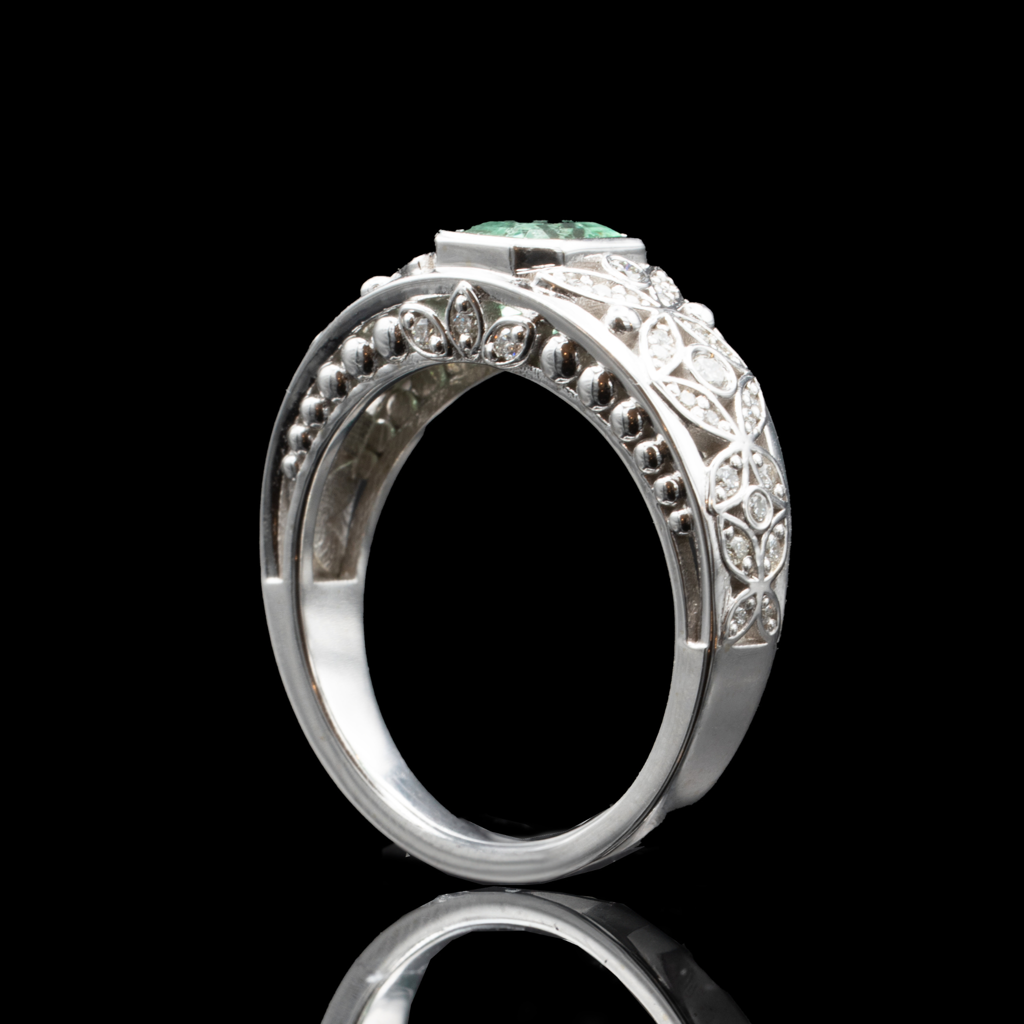 emerald and diamond flower engagement ring
