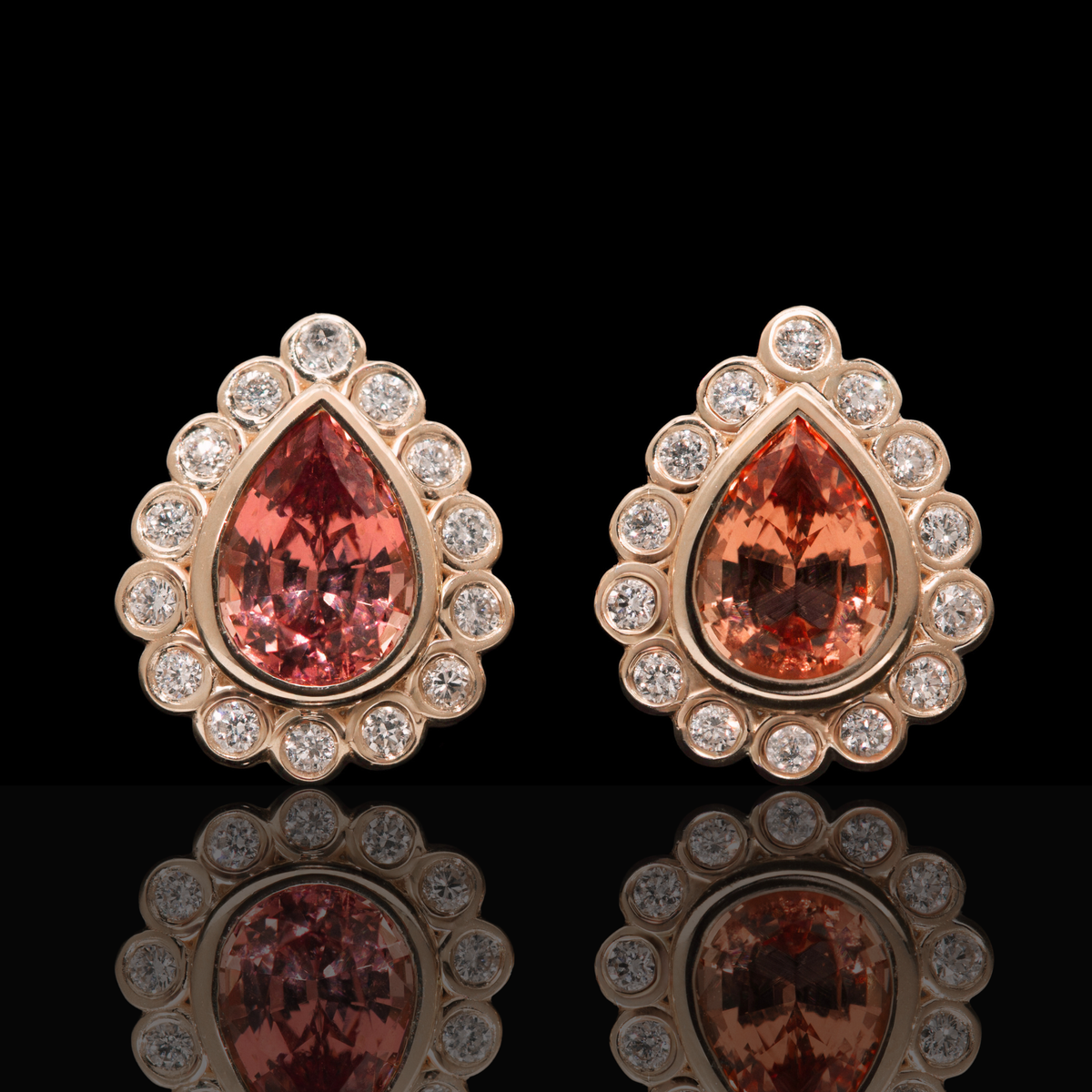 pear cut garnet earrings with diamonds
