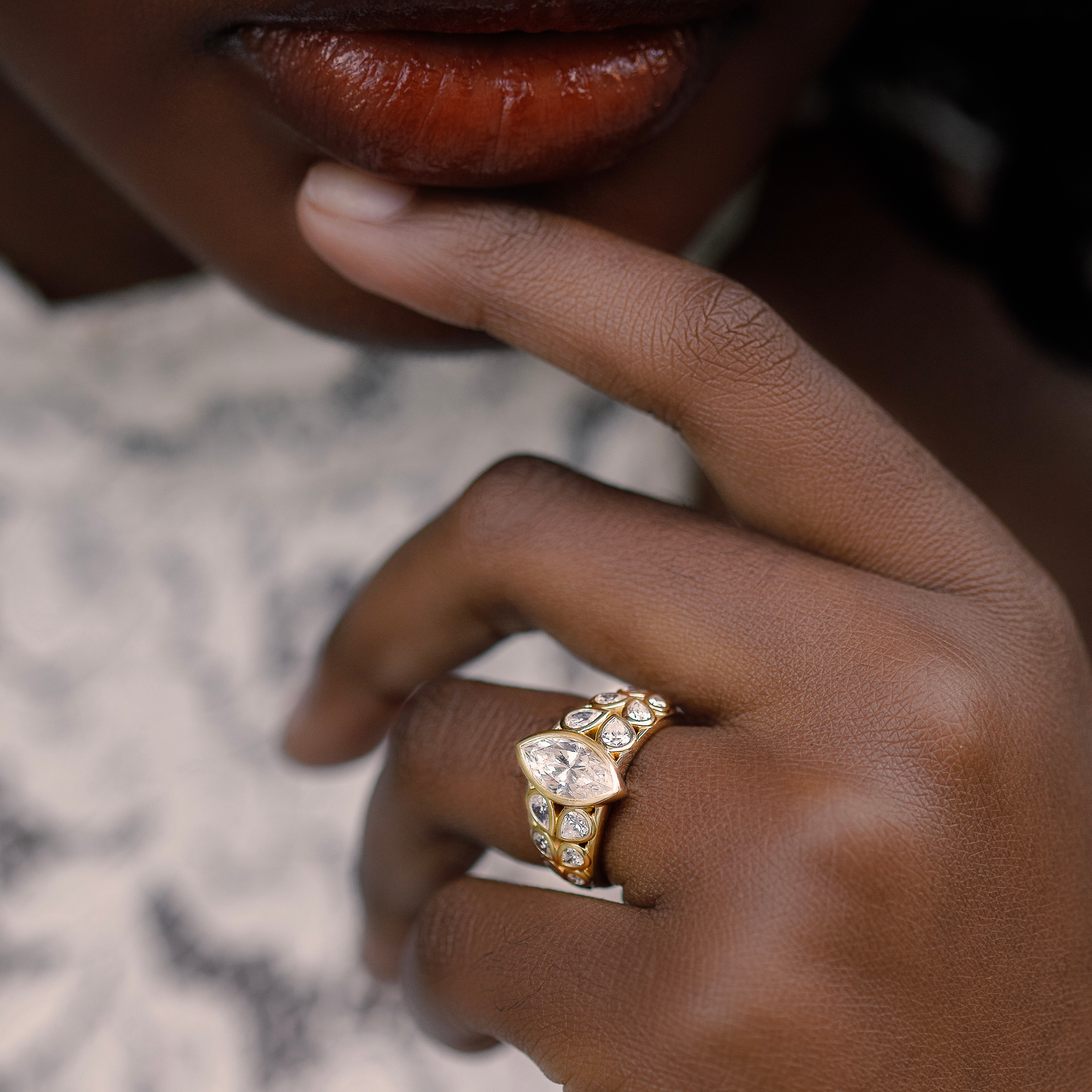 custom marquise diamond ring with modern elegant design. 14K yellow gold.