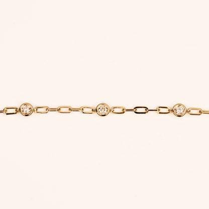 diamond charm necklace in 14k yellow on a paperclip necklace chain.