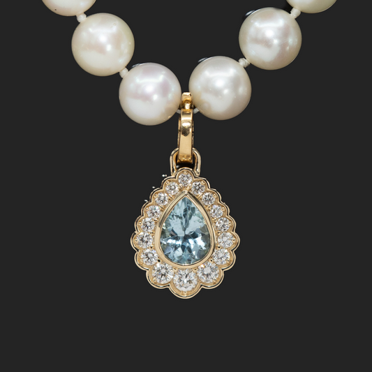 Aquamarine and diamond necklace charm in gold
