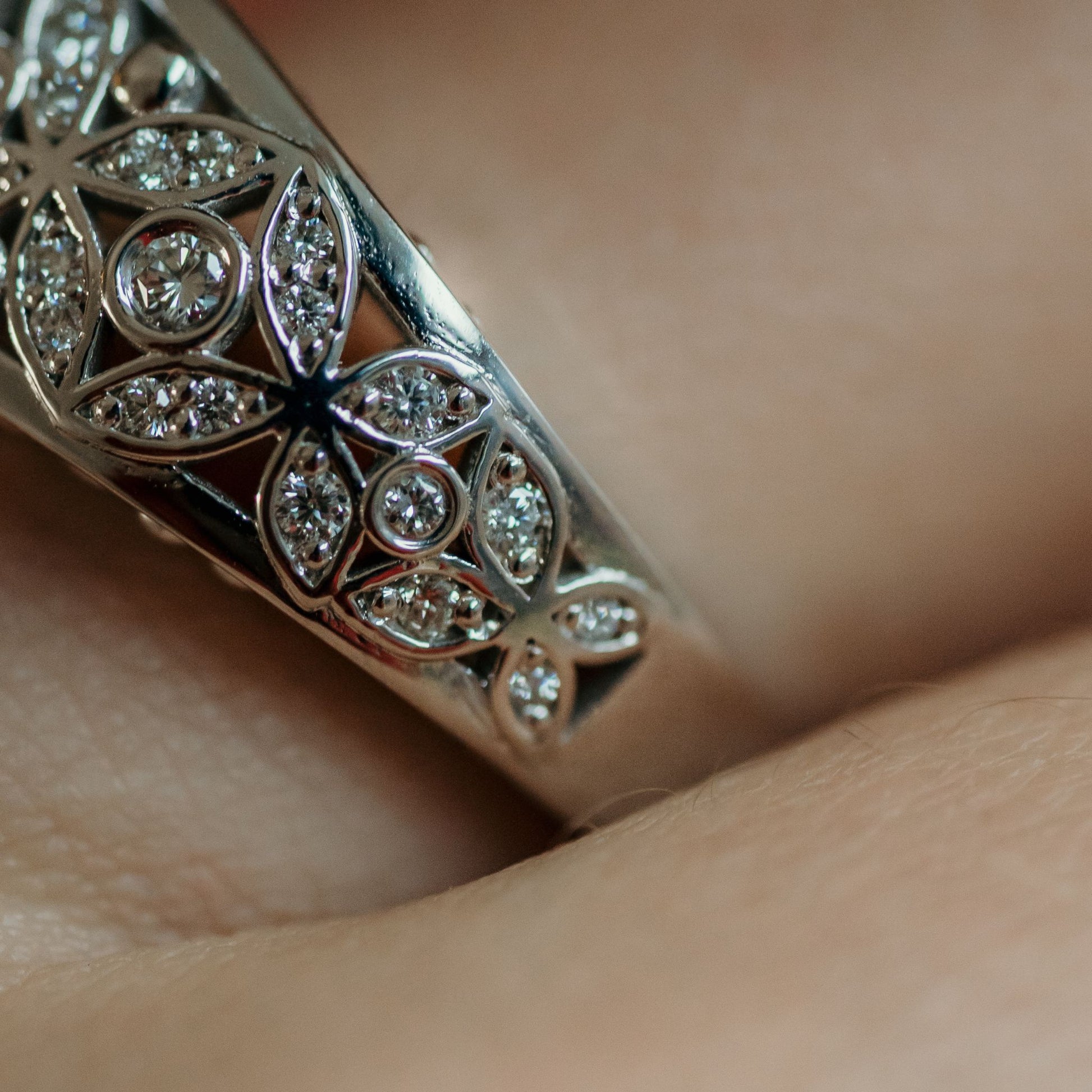 diamond and flower ring with emerald cut emerald