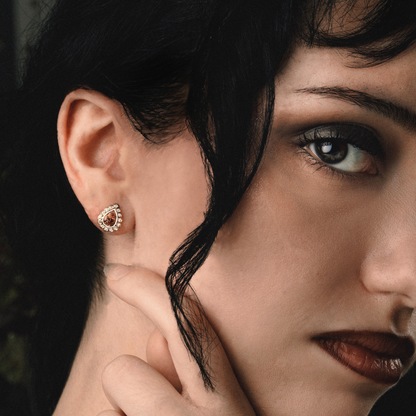 Garnet and diamond earrings set in bezels