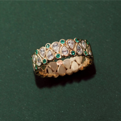 yellow gold and emerald wedding band with unique diamond pattern