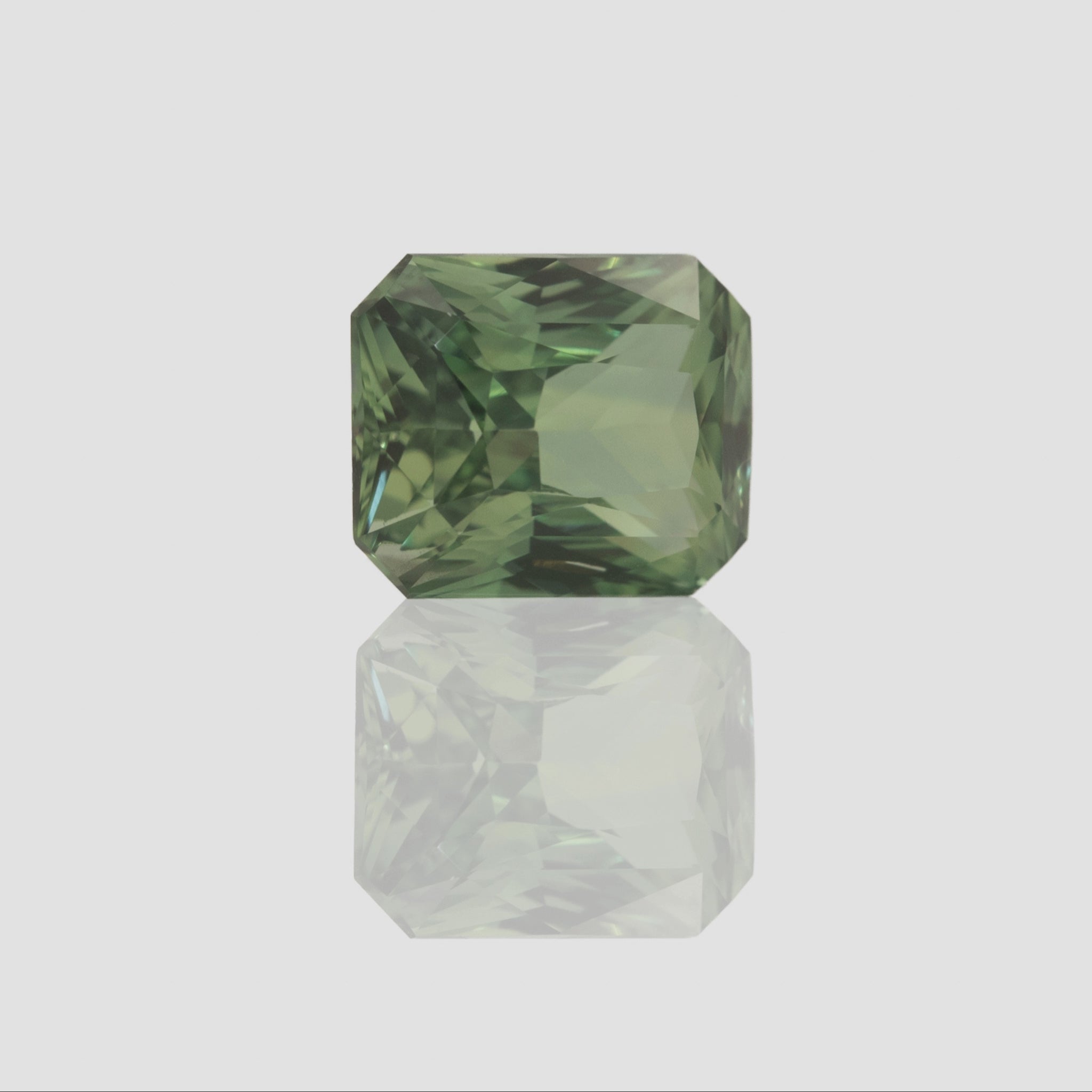 Green sapphire gemstone elongated radiant cut 