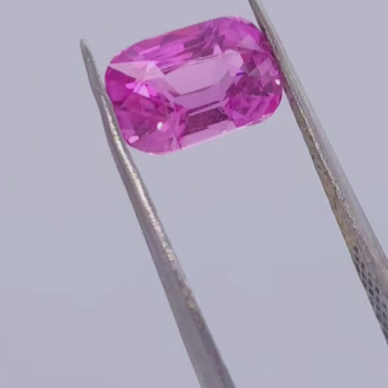Hot pink sapphire with intense saturation, elongated cushion cut, natural gemstone for sale