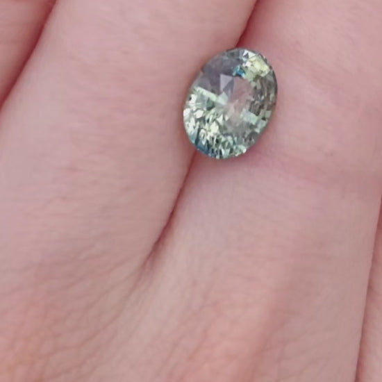 Oval green sapphire, teal and yellow bicolor, no heat color.
