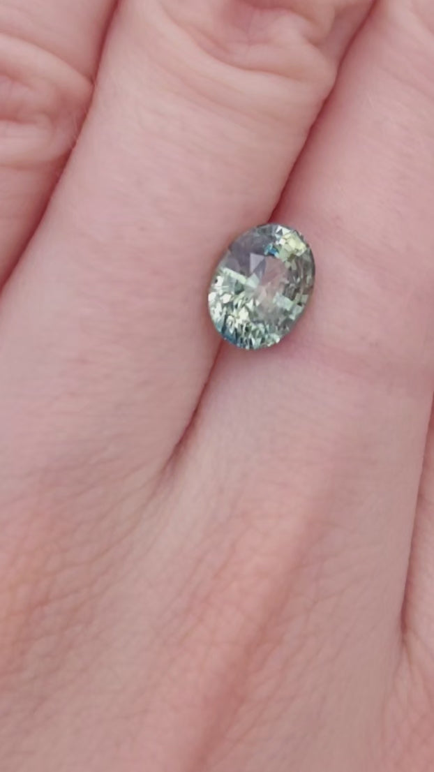 Oval green sapphire, teal and yellow bicolor, no heat color.