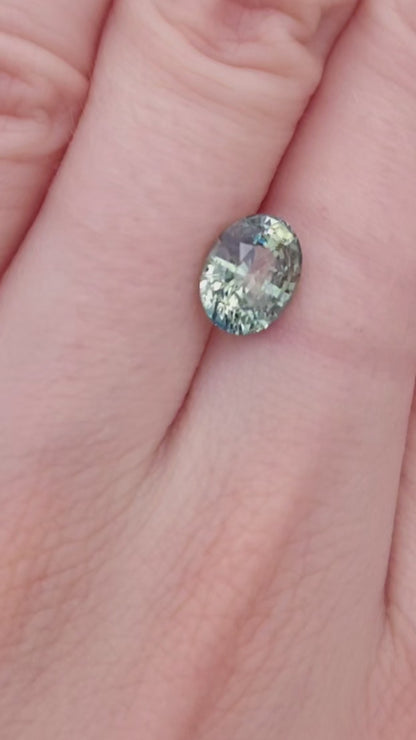Oval green sapphire, teal and yellow bicolor, no heat color.