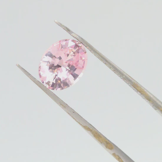 2.1ct peach colored sapphire, oval cut no heat