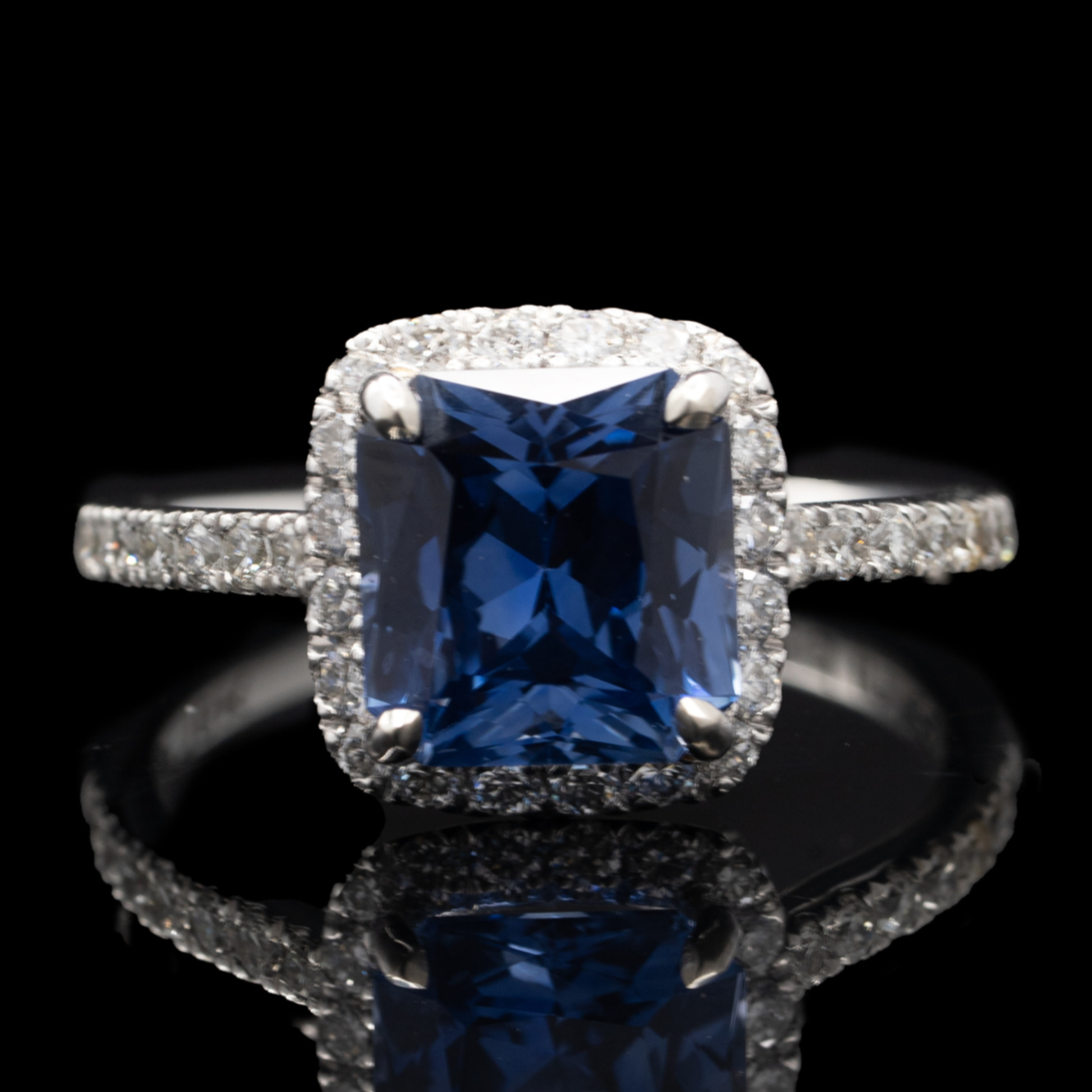Blue Sapphire and Diamond Halo Ring