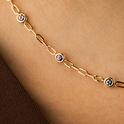 rainbow sapphire bezel charm necklace in gold.