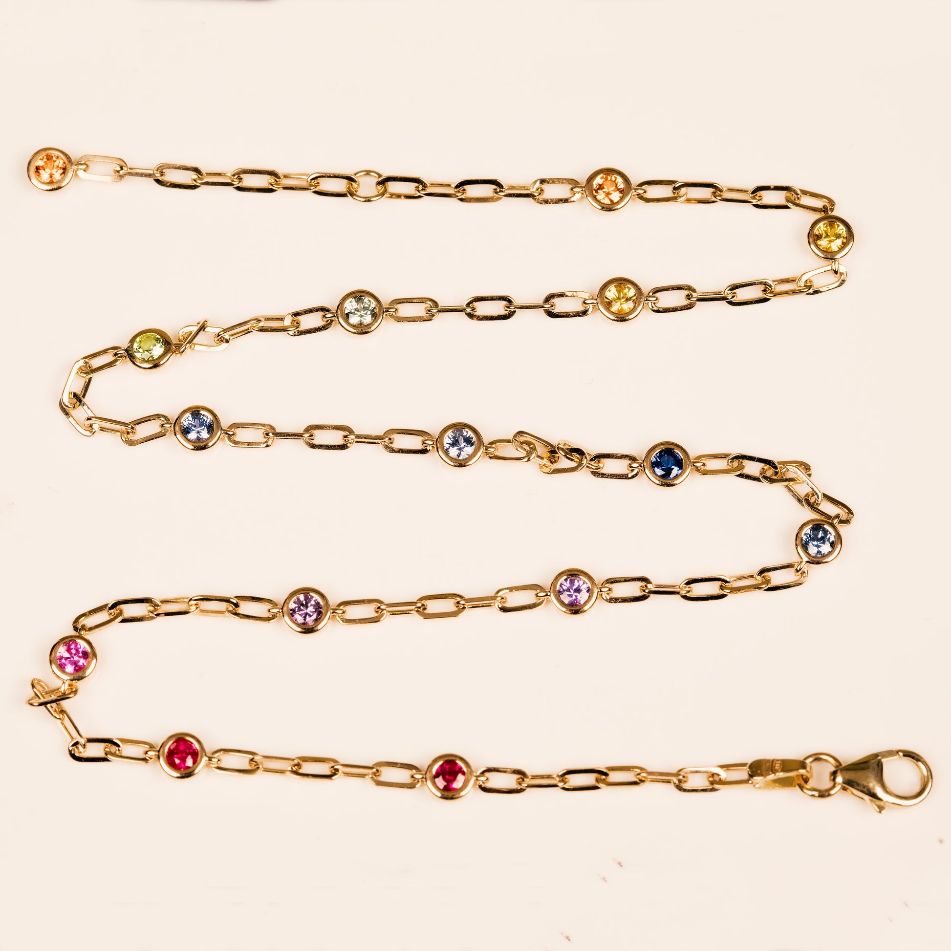 rainbow sapphire charm bracelet and necklace on paperclip chain.