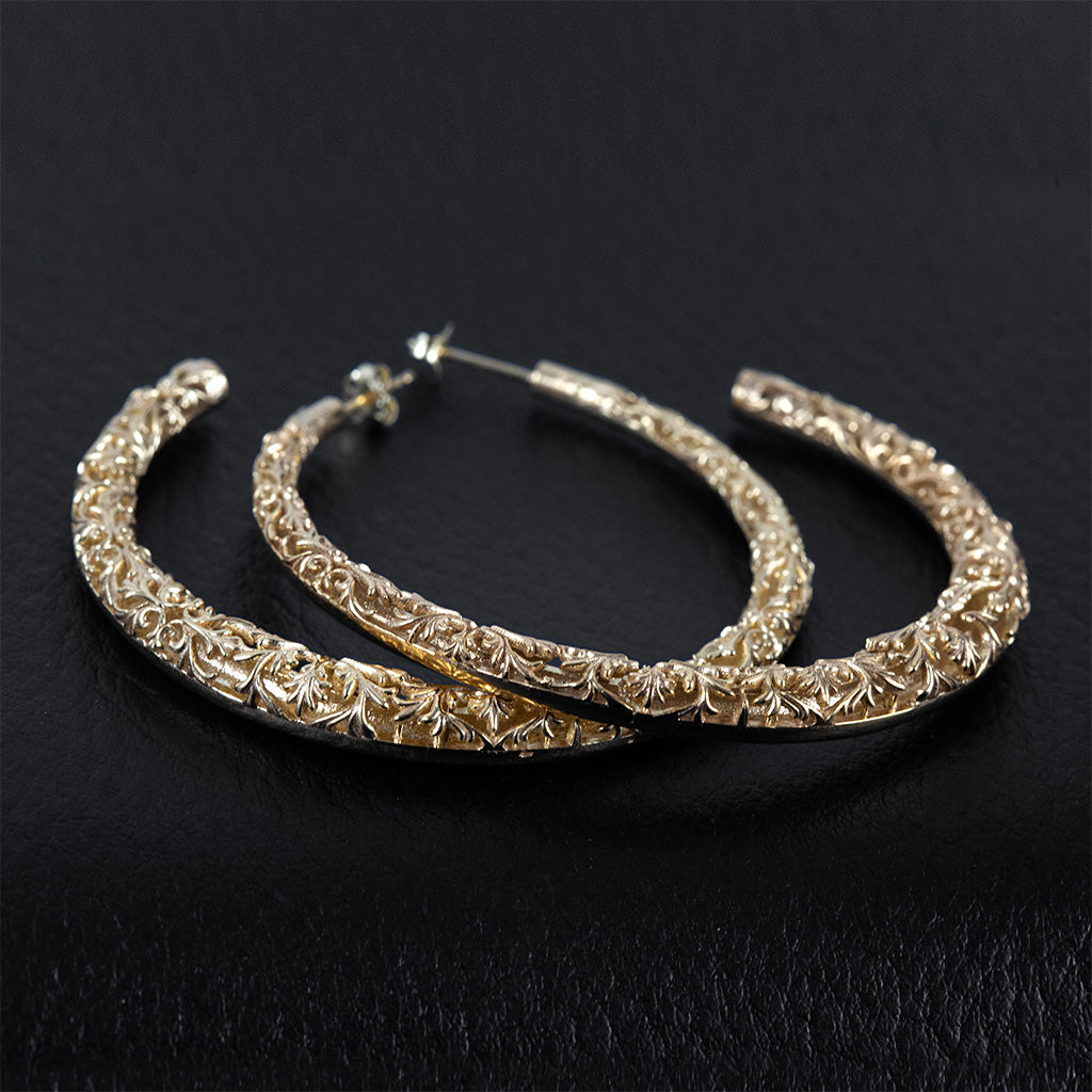 Big hoop earrings made in silver and gold plated.