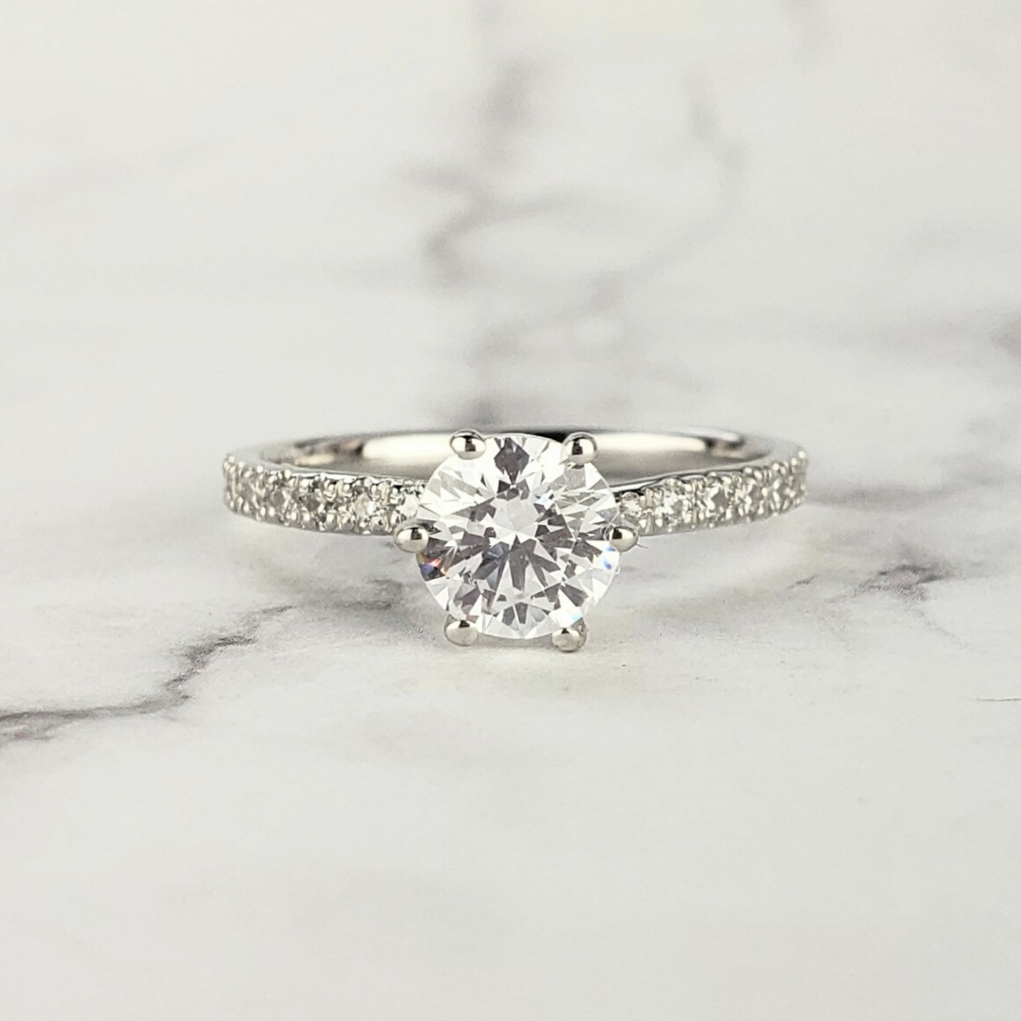 dainty solitaire diamond engagement ring