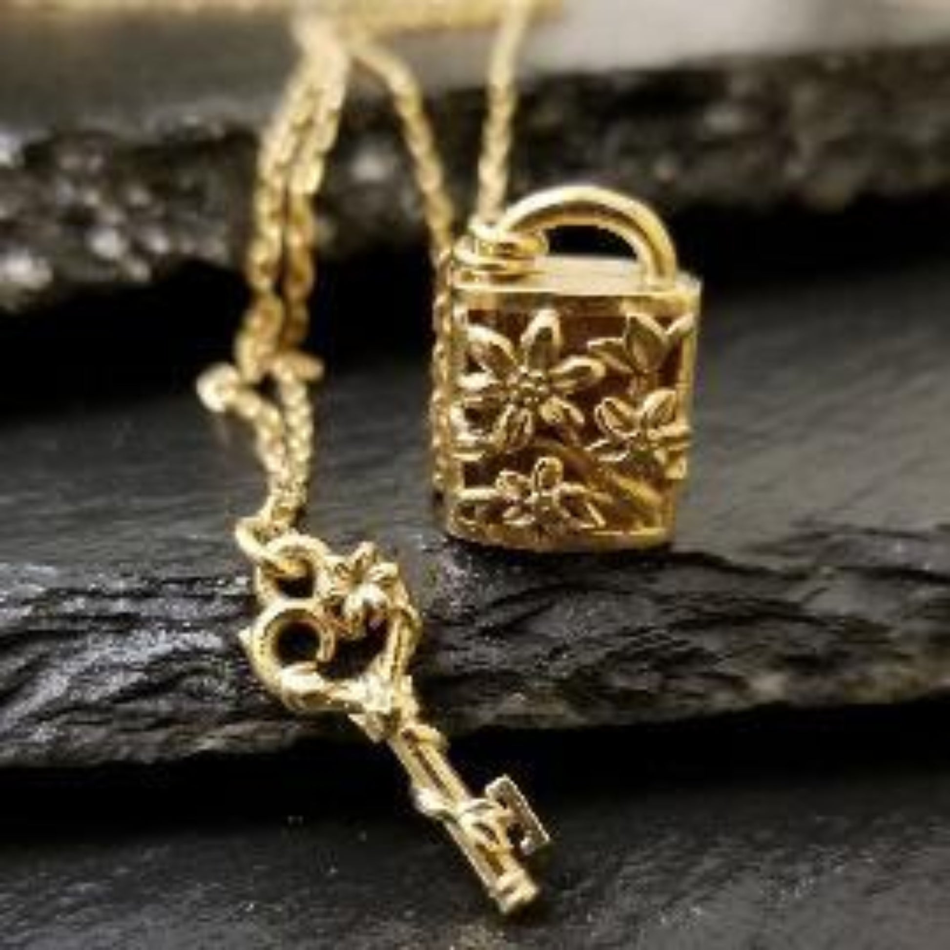 Yellow gold locket necklace with flowers