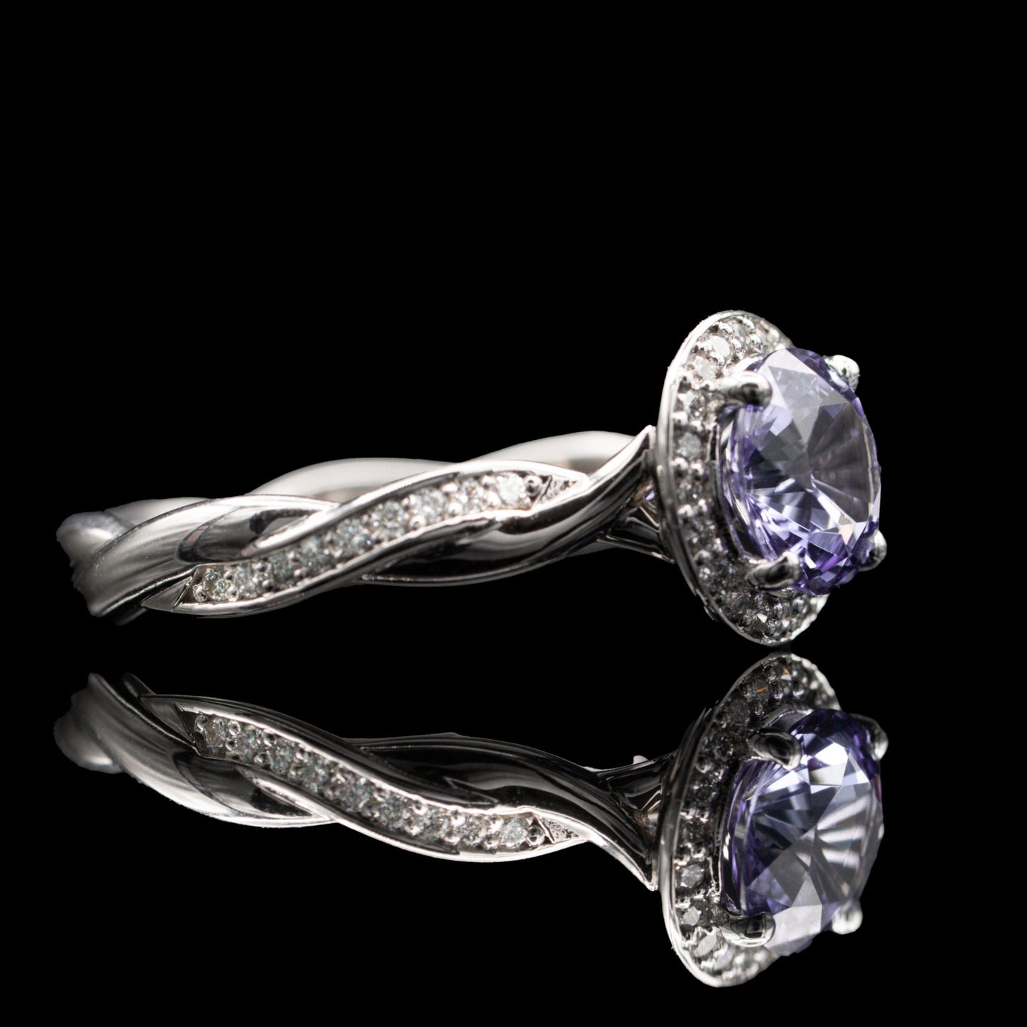 Diamond and Sapphire twisted halo ring