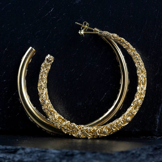 Big gold hoop earrings with a floral pattern