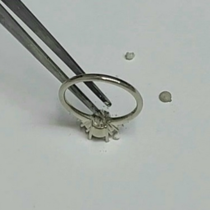 gold ring with ashes inside like an urn
