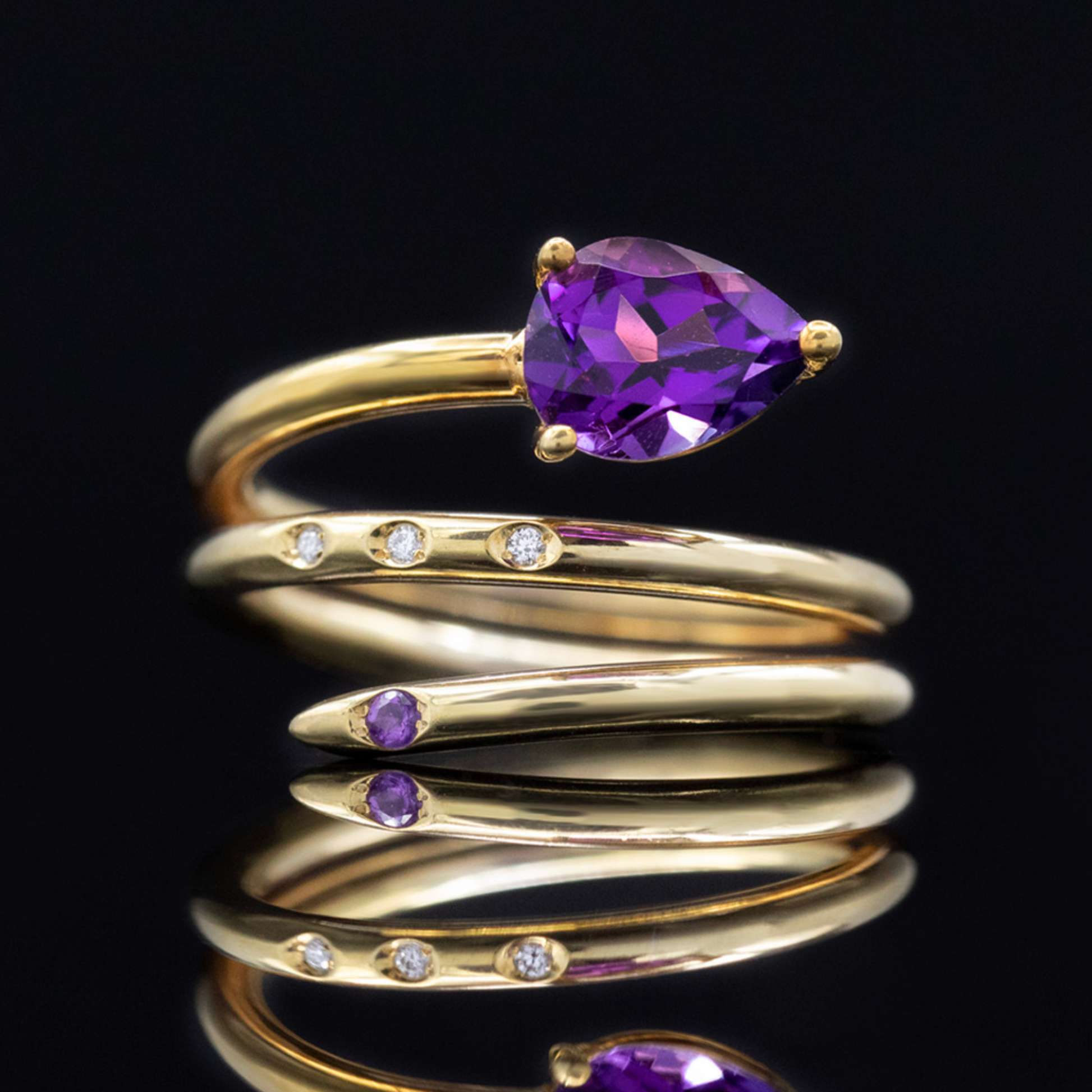 amethyst and diamond spiral ring in gold