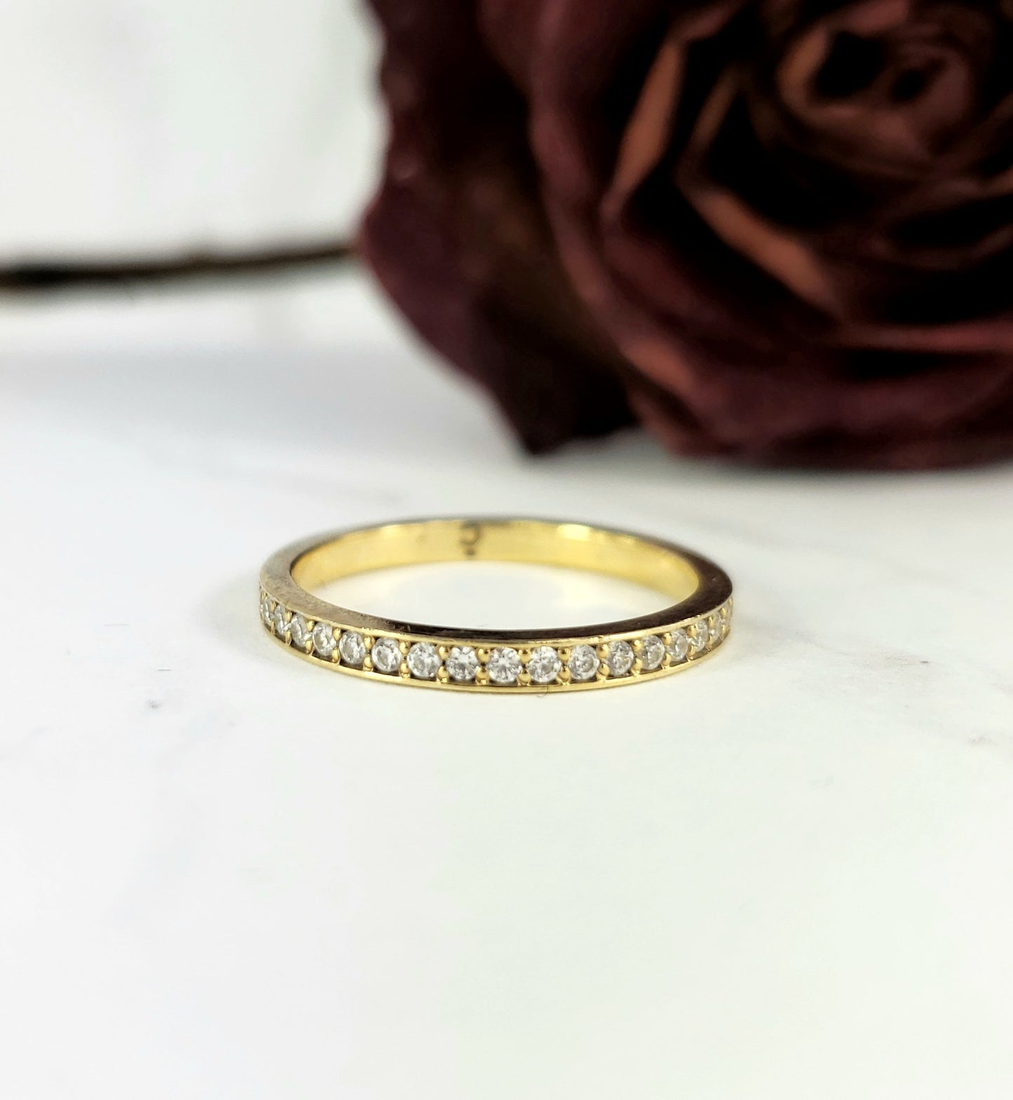 stackable wedding band in gold with diamonds