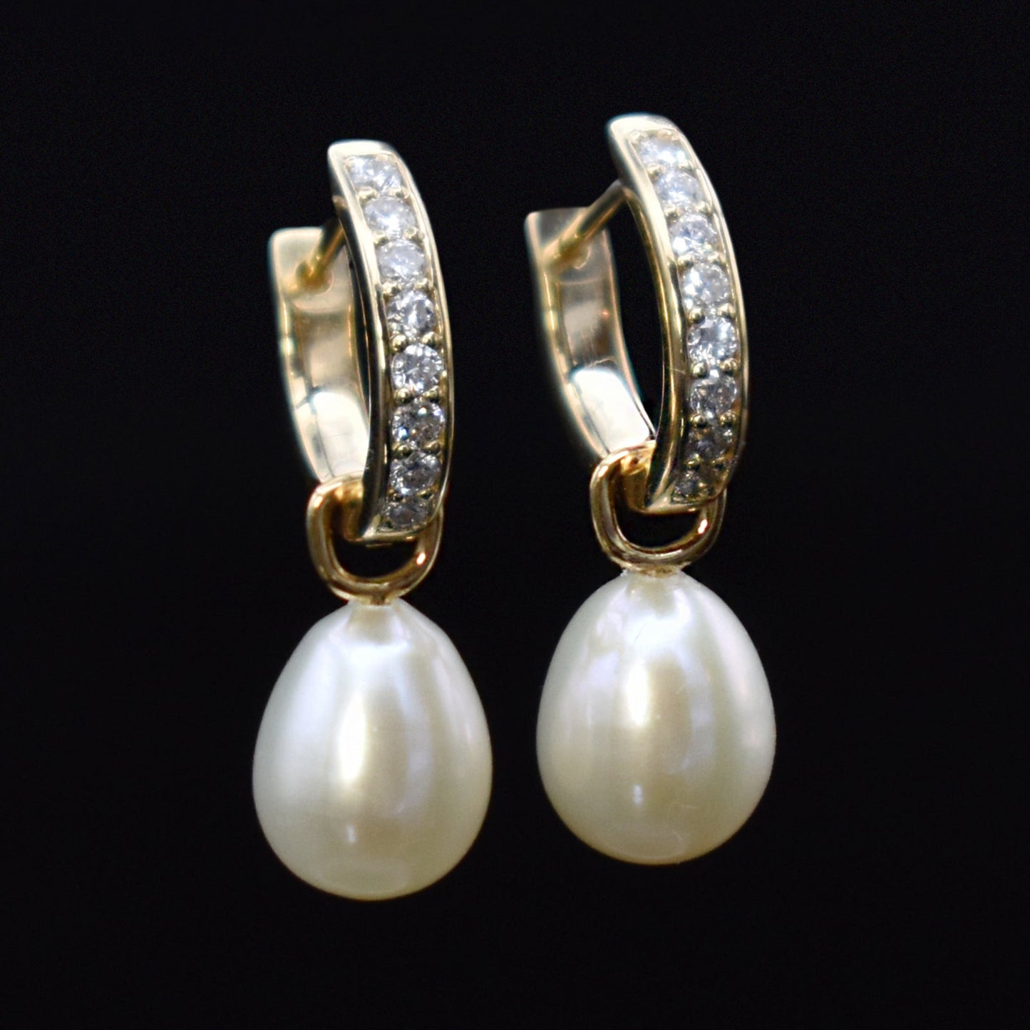 diamond and pearl huggies in 18K gold