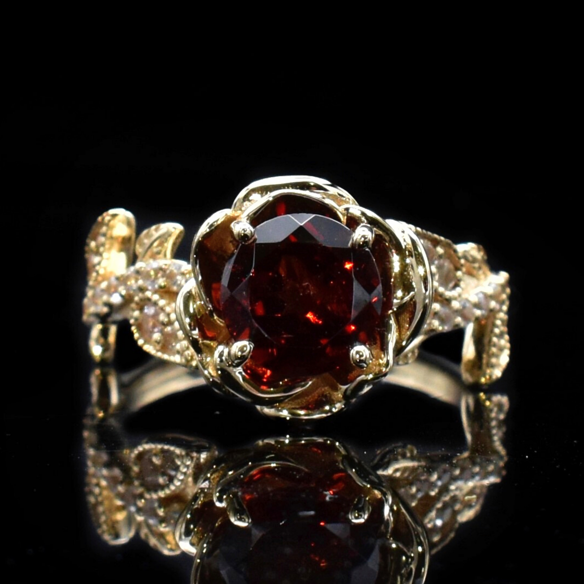 beauty and the beast ring in gold and garnet