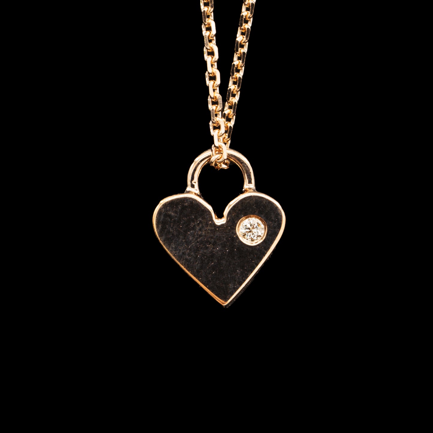 Heart shaped charm necklace with engravings 