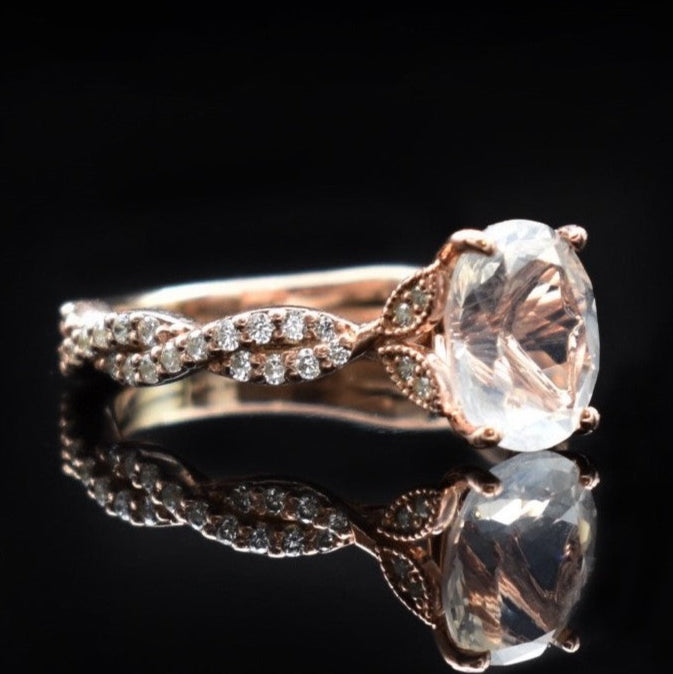 white sapphire engagement ring with rose gold twisting shank