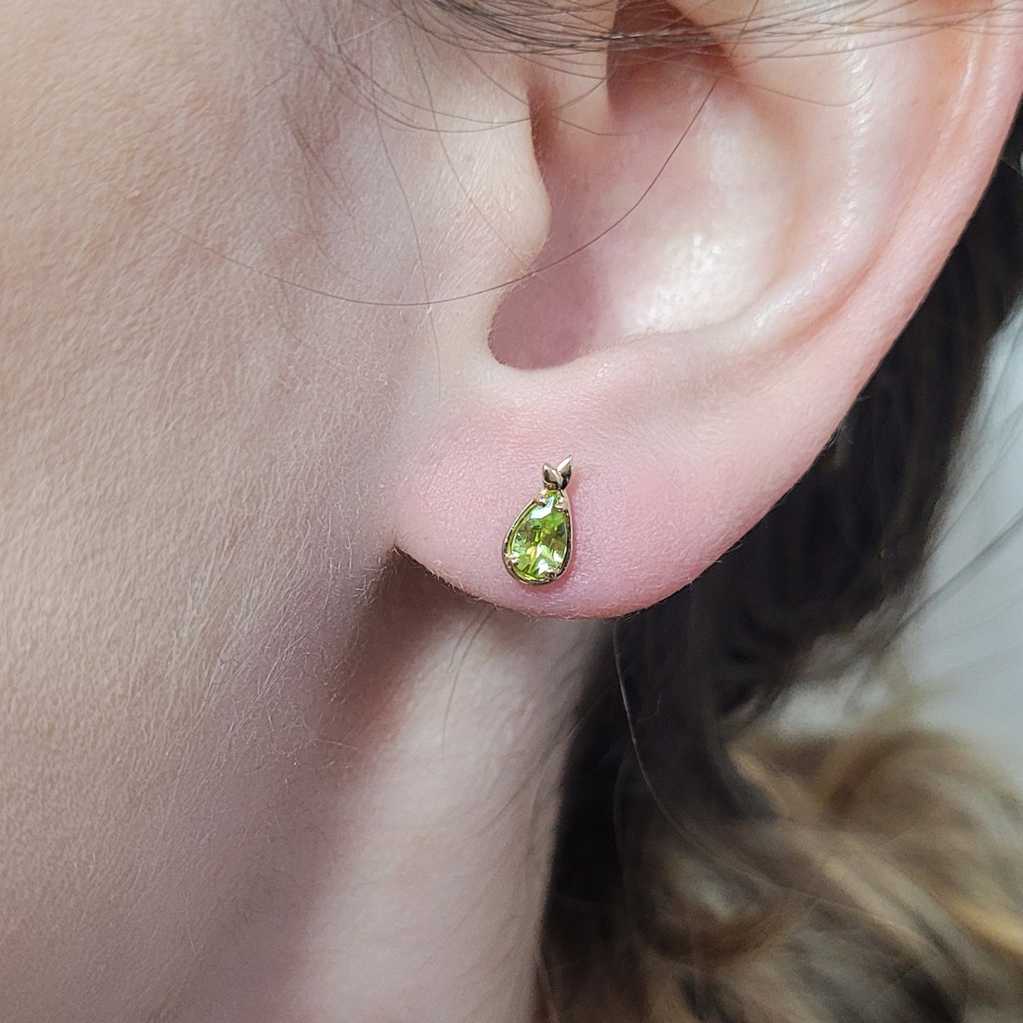 pear shaped fruit stud earrings with peridot 14k gold