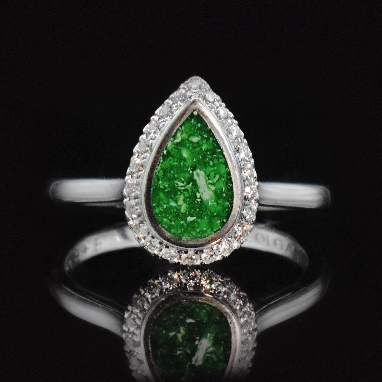 ashes ring with pear cut green resin and diamond