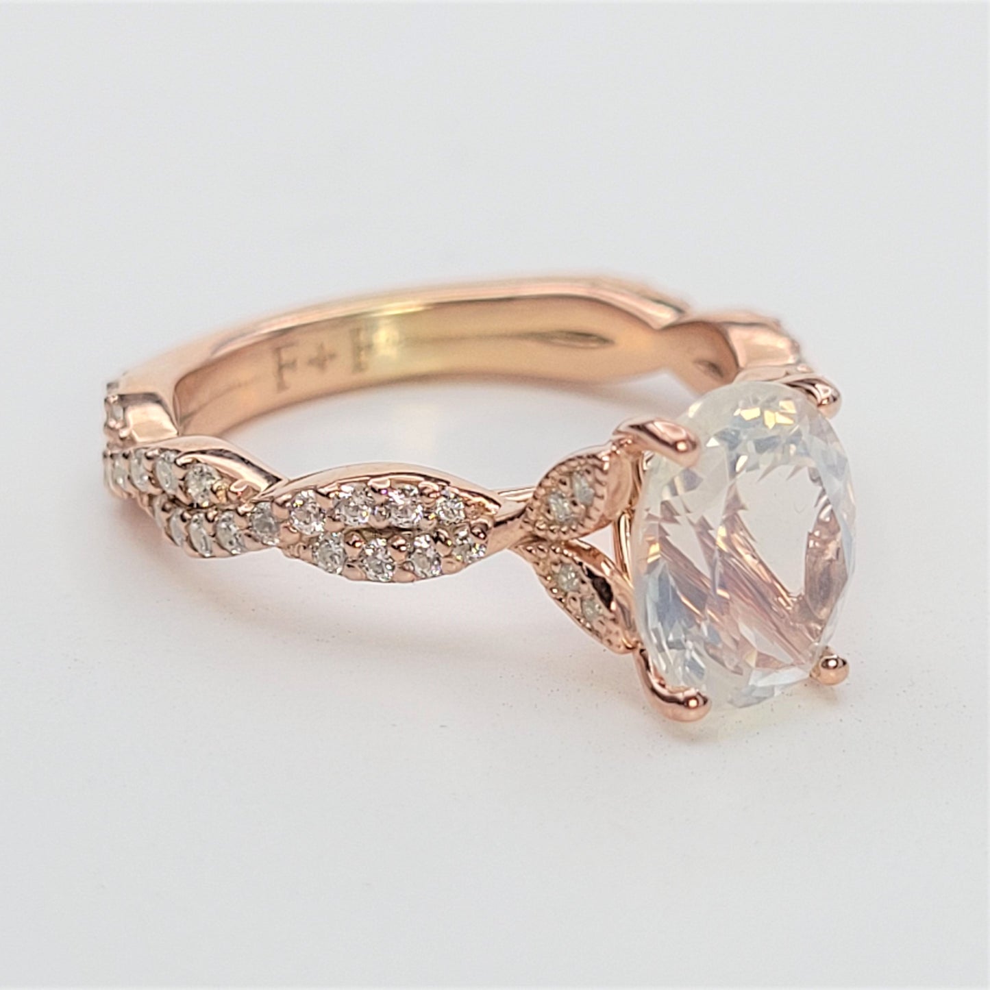 vintage floral engagement ring with twisting shank and diamonds