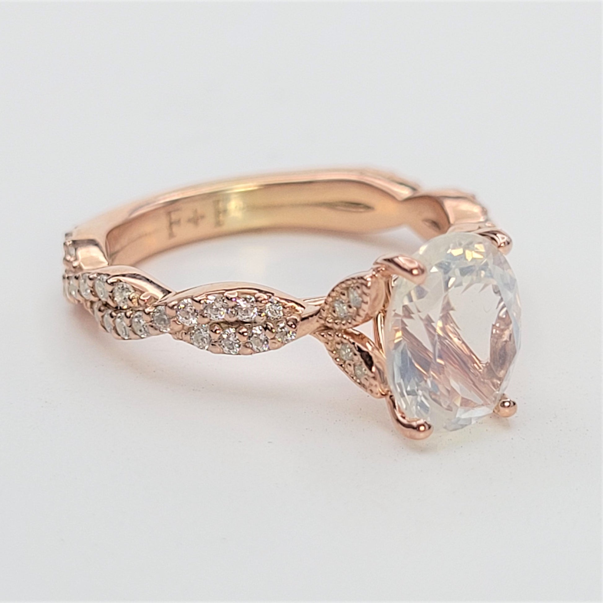 vintage floral engagement ring with twisting shank and diamonds